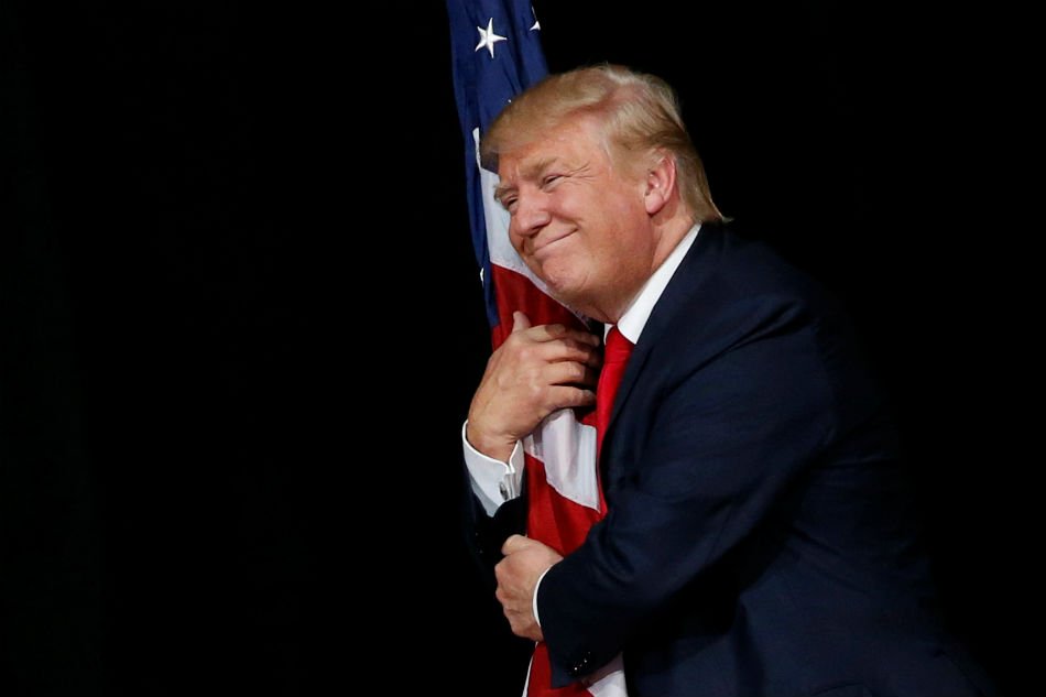 President Trump hugging the Flag